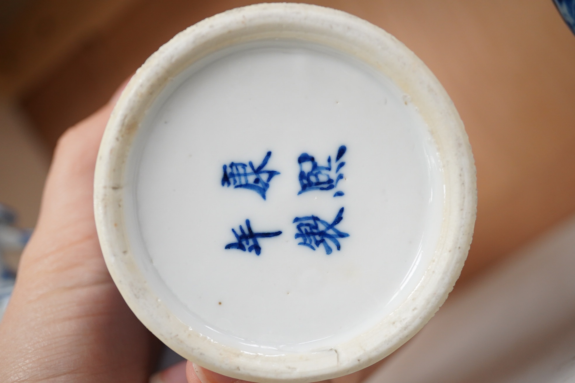 Late 19th century Chinese vases; pair of small Chinese blue and white moon flasks and a larger Chinese blue and white landscape vase, larger vase 22cm high. Condition - one moon flask handle restored, other items fair